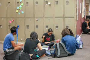 Students huddled in front of lockers